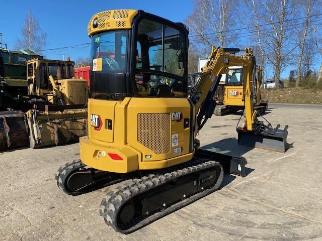 2023 Caterpillar 303CR mini excavator, rear three-quarter view 2023 Caterpillar 303CR mini excavator, rear three-quarter view