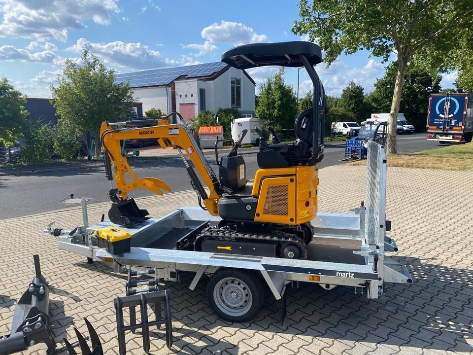 Berger Kraus BK1300JSR mini excavator on a trailer, side view Berger Kraus BK1300JSR mini excavator on a trailer, side view