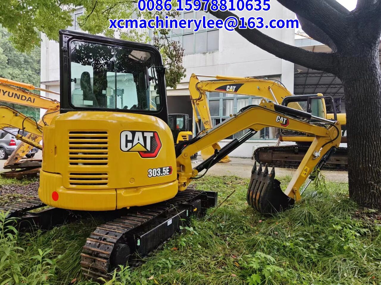 2024 Caterpillar 303.5E mini excavator, rear three-quarter view