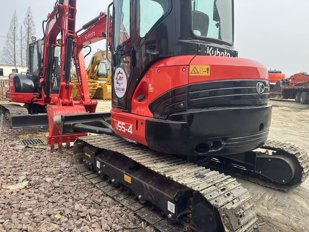 2024 Kubota U55-4 mini excavator, front three-quarter view