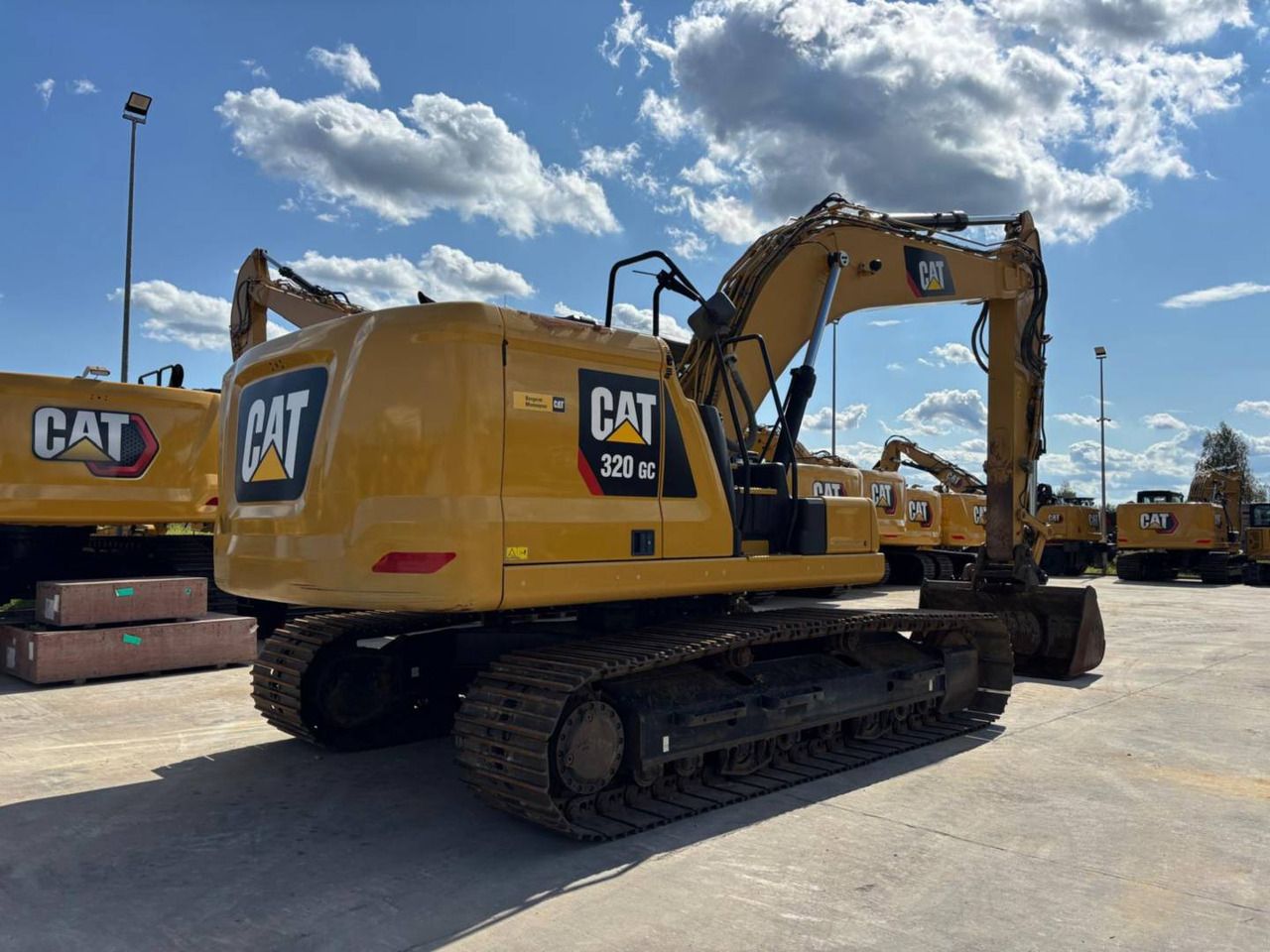 2022 Caterpillar 320GC crawler excavator, rear three-quarter view