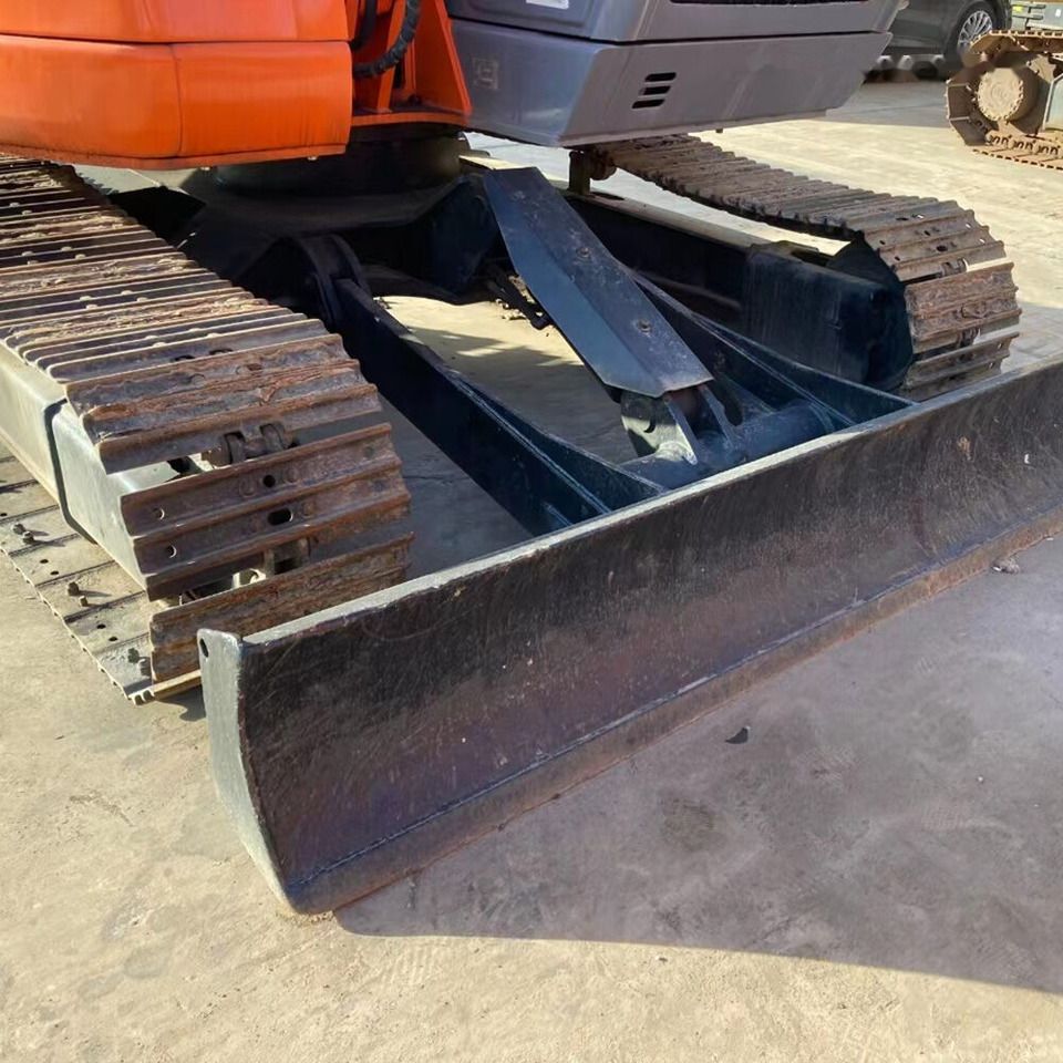 Hitachi ZX75US crawler excavator, front view of blade and tracks Hitachi ZX75US crawler excavator, front view of blade and tracks