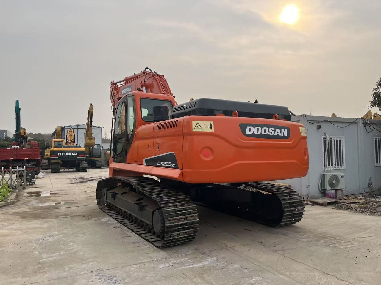 2023 Doosan DX225.LCA crawler excavator, rear three-quarter view 2023 Doosan DX225.LCA crawler excavator, rear three-quarter view