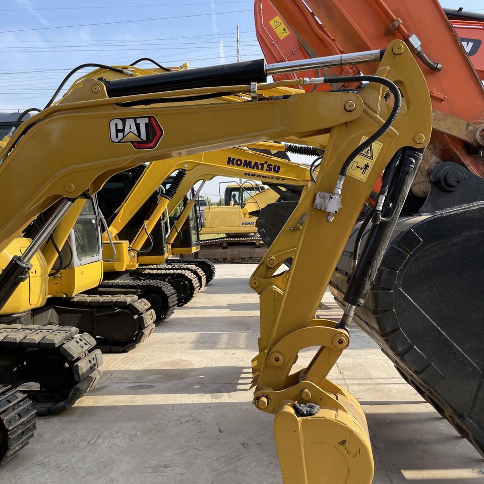 Caterpillar 303.5 mini excavator, side view of boom and arm Caterpillar 303.5 mini excavator, side view of boom and arm