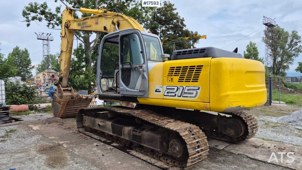 2005 New Holland E215 crawler excavator, rear three-quarter view 2005 New Holland E215 crawler excavator, rear three-quarter view