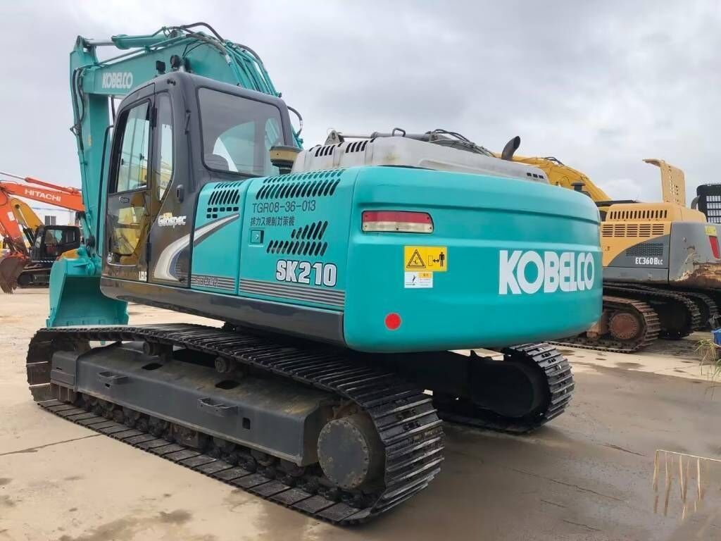 2024 Kobelco SK210 crawler excavator, rear three-quarter view