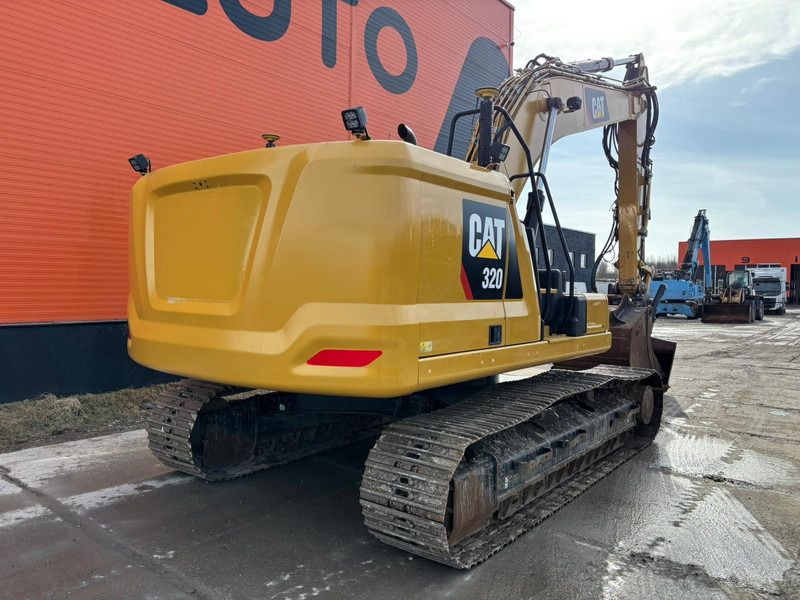 2018 Caterpillar 320 crawler excavator, rear three-quarter view
