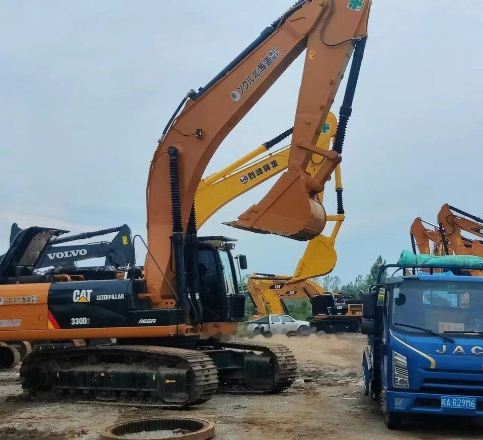 Caterpillar 330D2 crawler excavator, side view Caterpillar 330D2 crawler excavator, side view