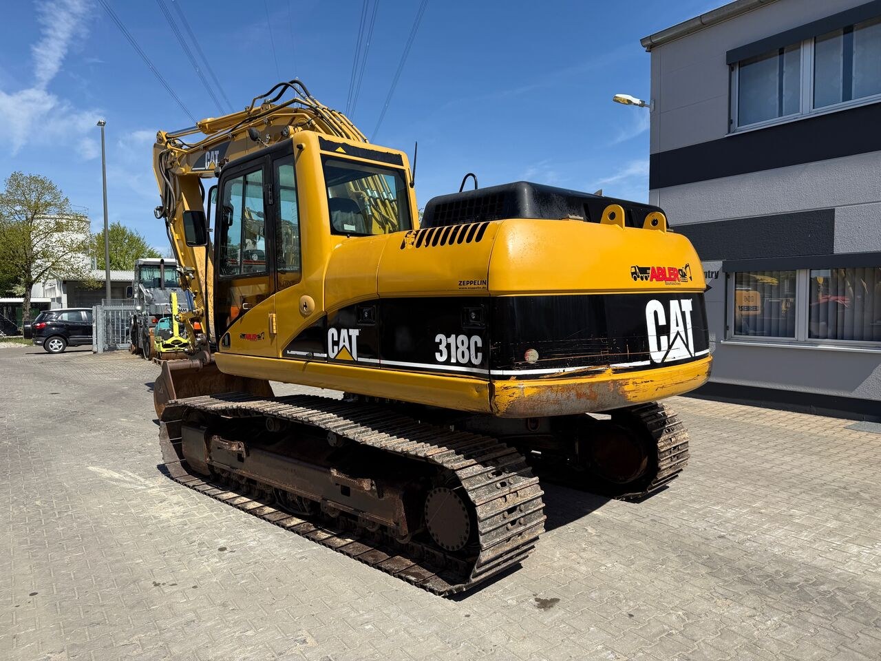 2005 Caterpillar 318C crawler excavator, rear three-quarter view 2005 Caterpillar 318C crawler excavator, rear three-quarter view
