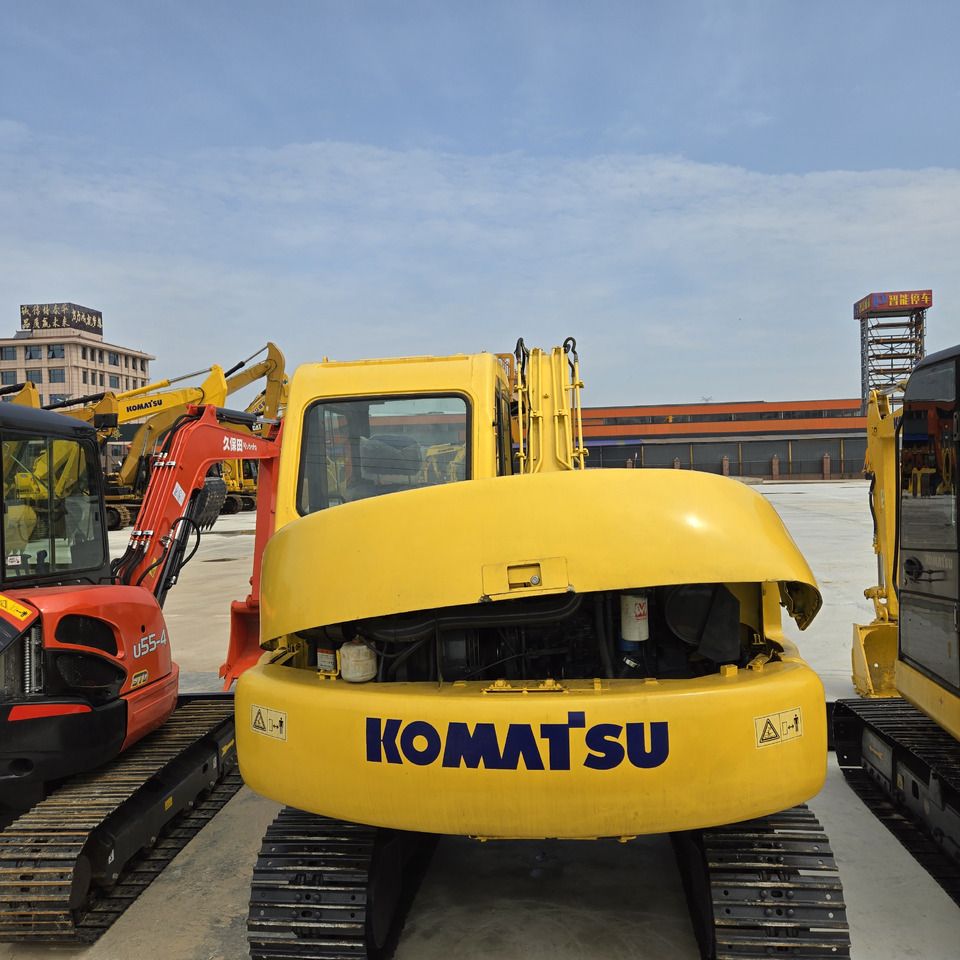 2020 Komatsu PC60 mini excavator, rear view with engine cover open 2020 Komatsu PC60 mini excavator, rear view with engine cover open