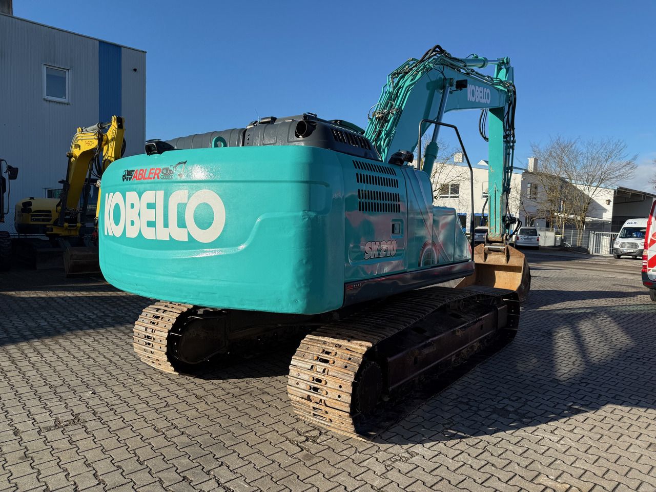 2018 Kobelco SK210 NLC-10 crawler excavator, rear three-quarter view 2018 Kobelco SK210 NLC-10 crawler excavator, rear three-quarter view