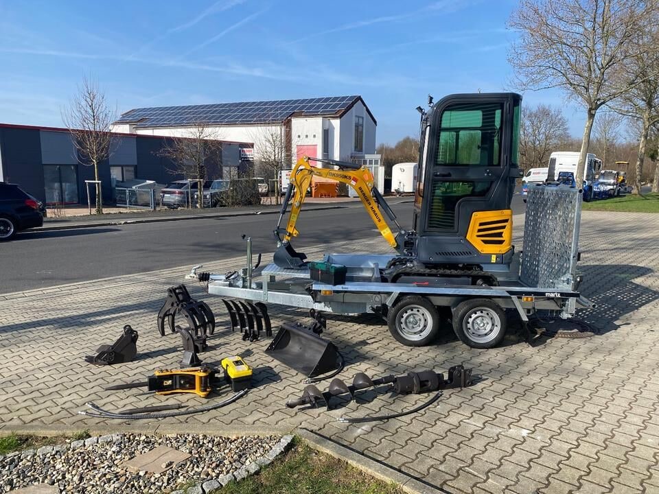 Berger Kraus BK950KS mini excavator on trailer with attachments