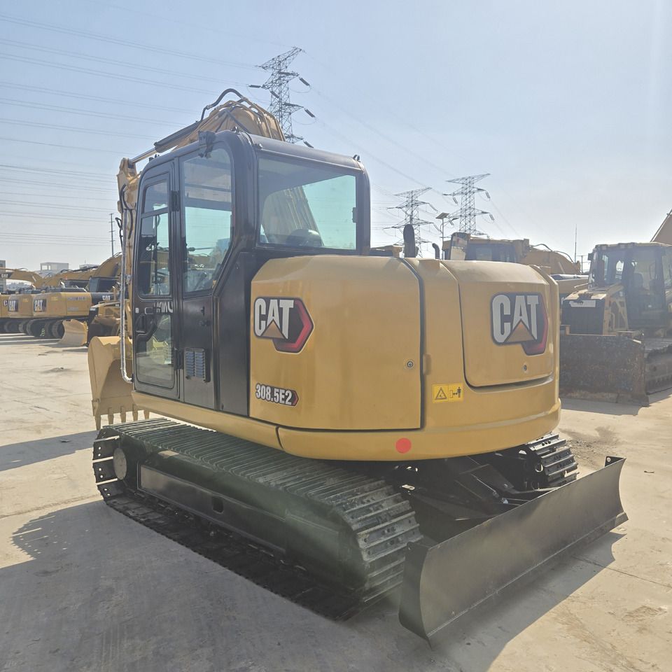 2023 Caterpillar 308.5E2 mini excavator, rear three-quarter view 2023 Caterpillar 308.5E2 mini excavator, rear three-quarter view