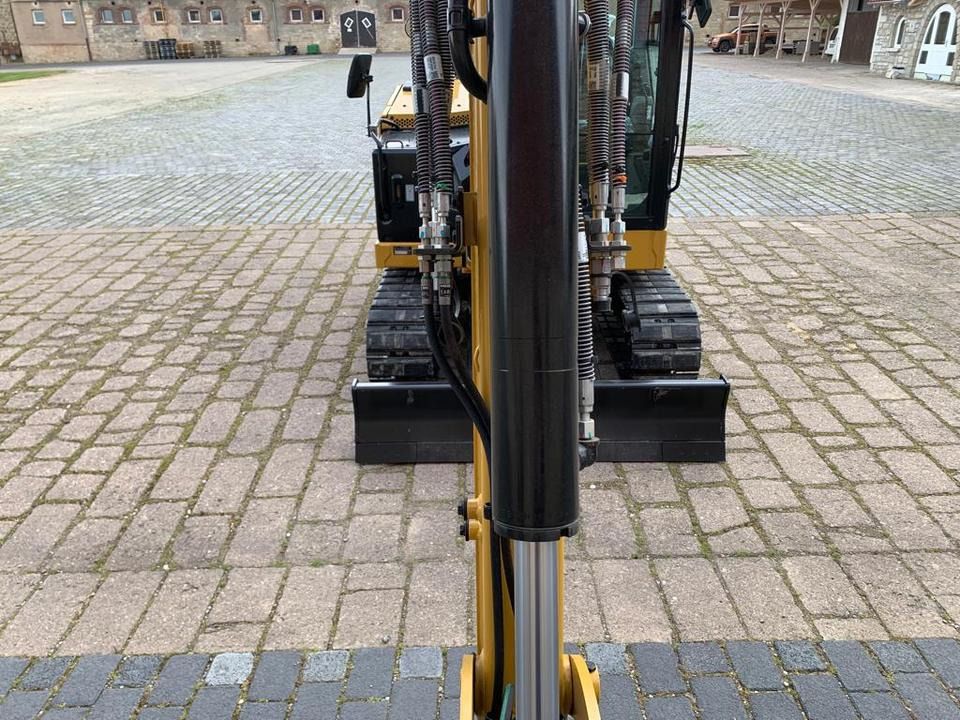 Caterpillar 306CR-07A mini excavator, front view from boom perspective Caterpillar 306CR-07A mini excavator, front view from boom perspective
