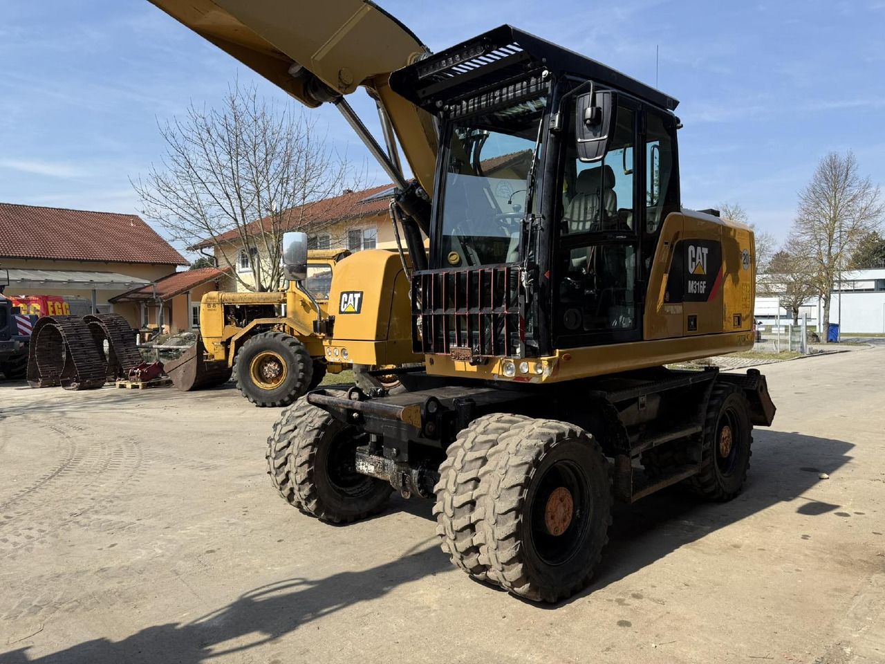 2016 Caterpillar M316F wheel excavator, front three-quarter view