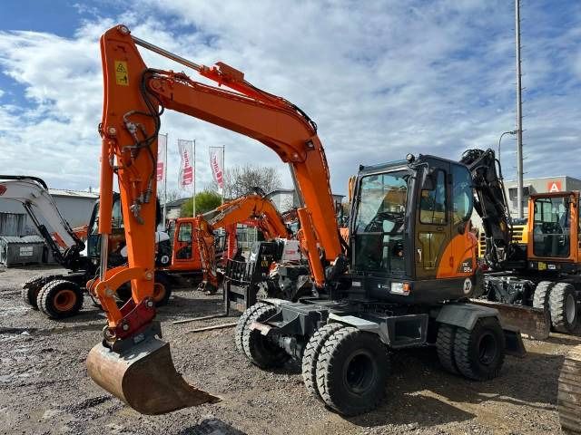 2014 Doosan DX55W wheel excavator, front three-quarter view 2014 Doosan DX55W wheel excavator, front three-quarter view