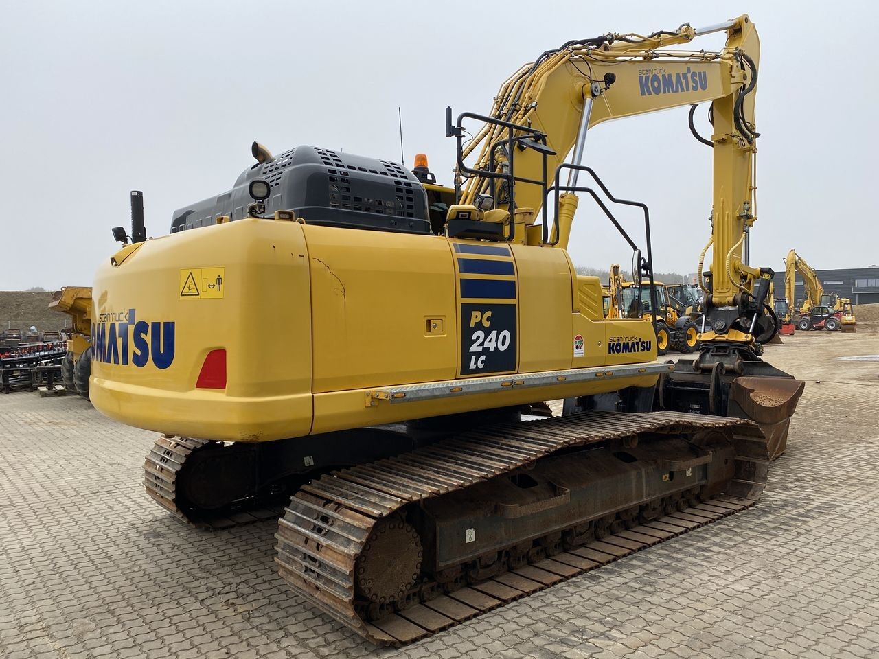 2021 Komatsu PC240LC-11 crawler excavator, rear three-quarter view 2021 Komatsu PC240LC-11 crawler excavator, rear three-quarter view
