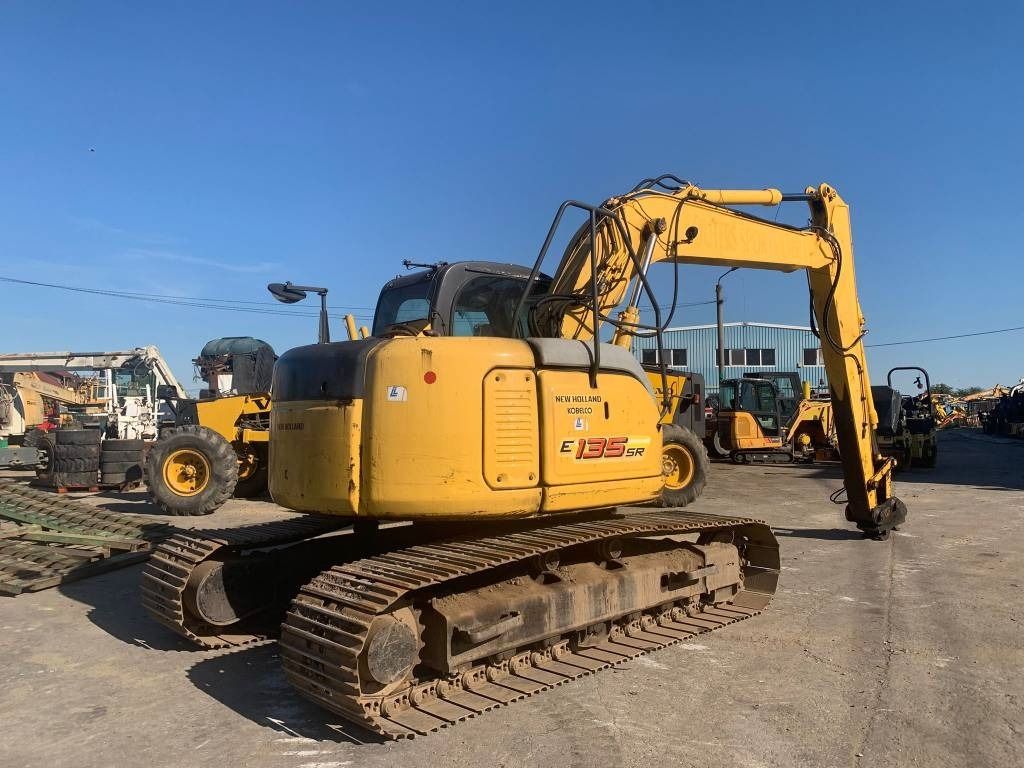 2006 New Holland E135SR crawler excavator rear three-quarter view