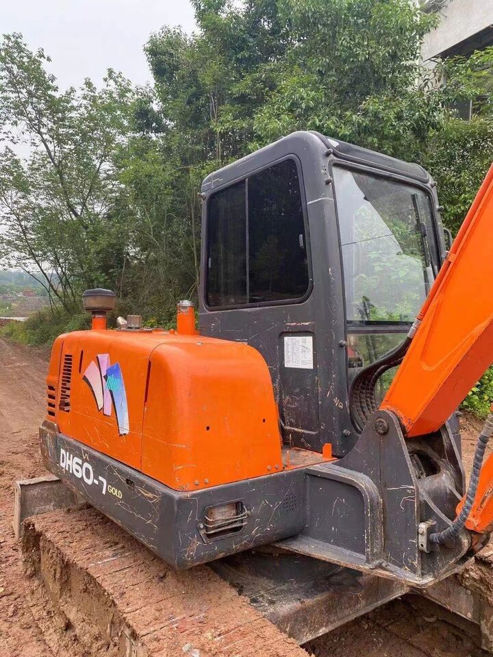 2024 Doosan DH60-7 Gold mini excavator, side view 2024 Doosan DH60-7 Gold mini excavator, side view