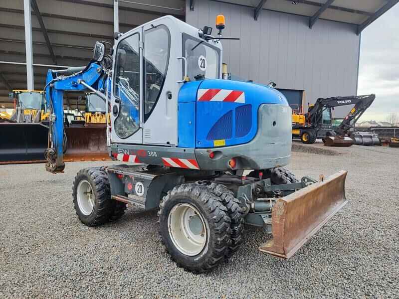 2017 Wacker Neuson EW100 wheel excavator, rear three-quarter view 2017 Wacker Neuson EW100 wheel excavator, rear three-quarter view