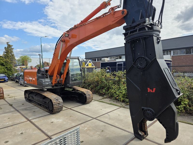 2011 Sennebogen ZX210 scrap shear, side view