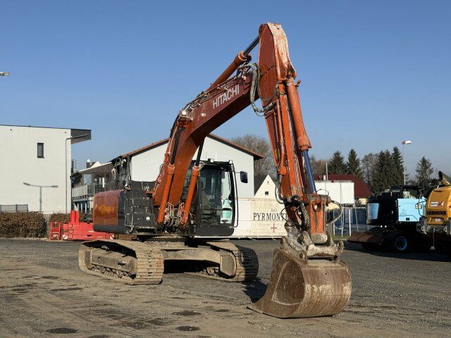 2021 Hitachi ZX210LC-6 crawler excavator, front three-quarter view 2021 Hitachi ZX210LC-6 crawler excavator, front three-quarter view