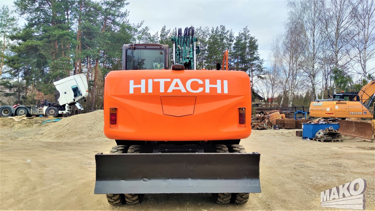 2012 Hitachi ZX140W-3 wheel excavator, rear view 2012 Hitachi ZX140W-3 wheel excavator, rear view