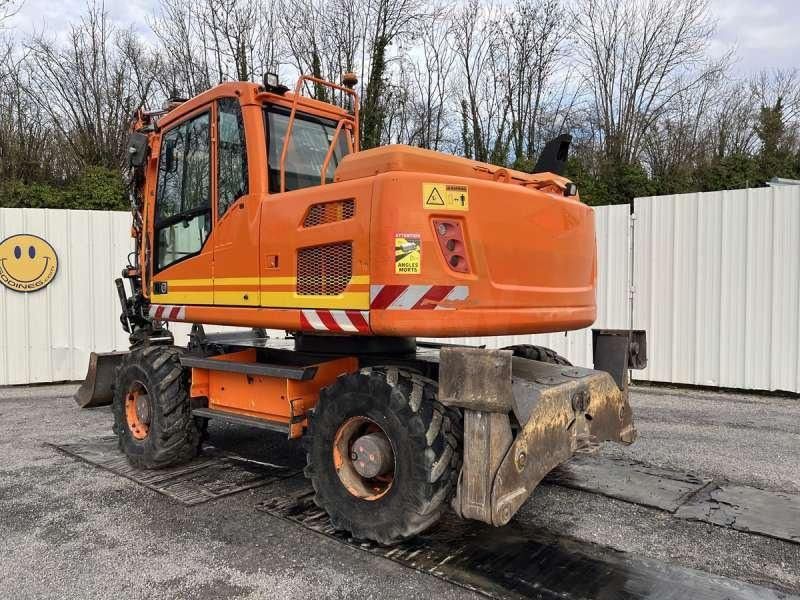 2012 Volvo EW140D wheel excavator rear three-quarter view