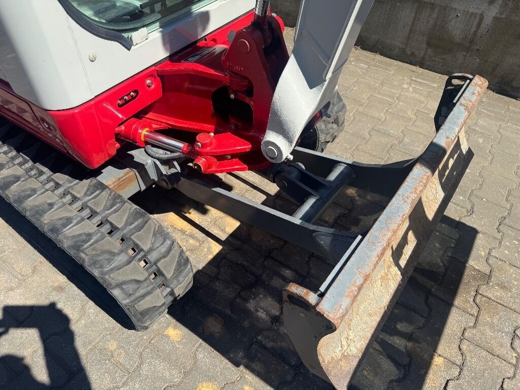 2020 Takeuchi TB216 mini excavator front blade and undercarriage view 2020 Takeuchi TB216 mini excavator front blade and undercarriage view