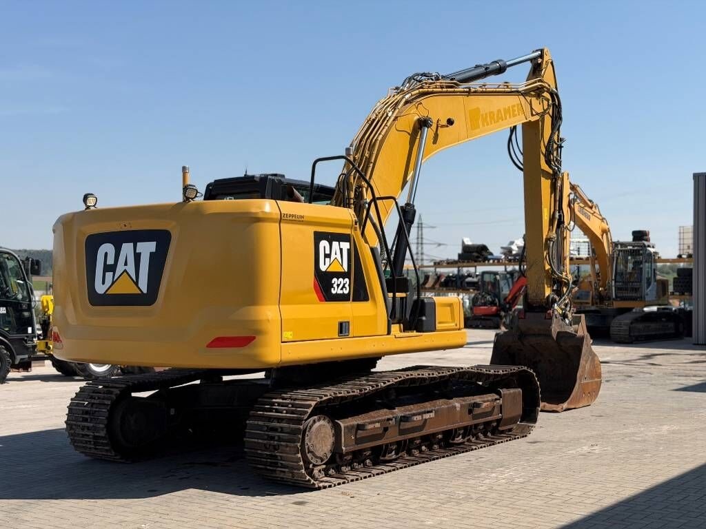 2018 Caterpillar 323 crawler excavator, rear three-quarter view