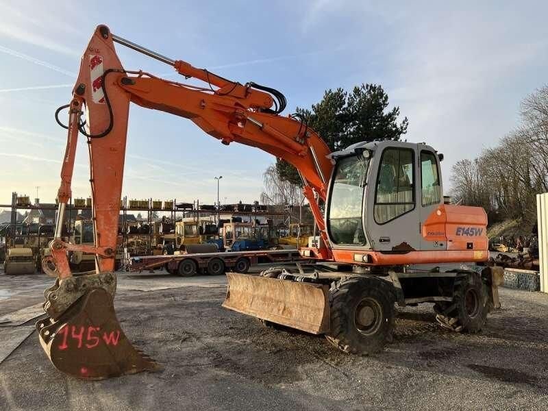 2004 Kobelco E145W wheel excavator side view 2004 Kobelco E145W wheel excavator side view