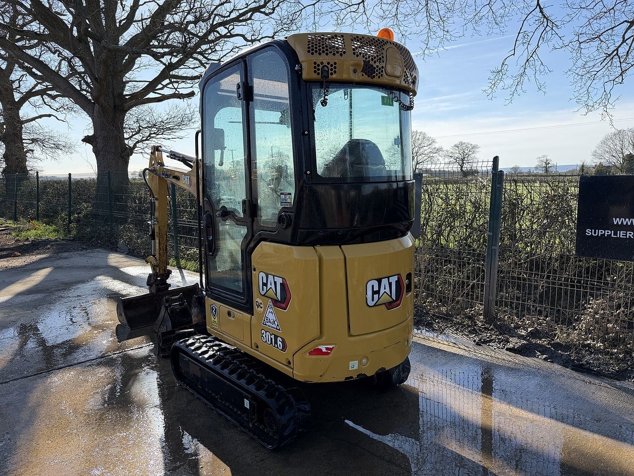 2021 Caterpillar 301.6 mini excavator, rear three-quarter view