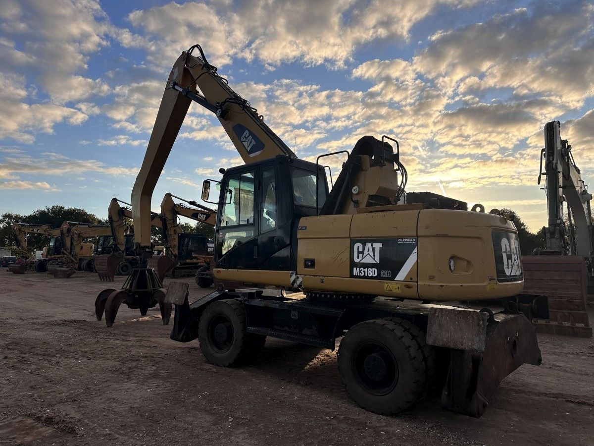 2012 Caterpillar M318D MH wheel excavator, rear three-quarter view