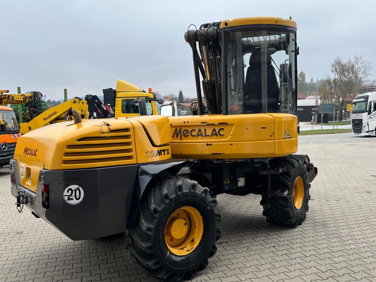 2010 Mecalac 12MTX wheel excavator, rear three-quarter view