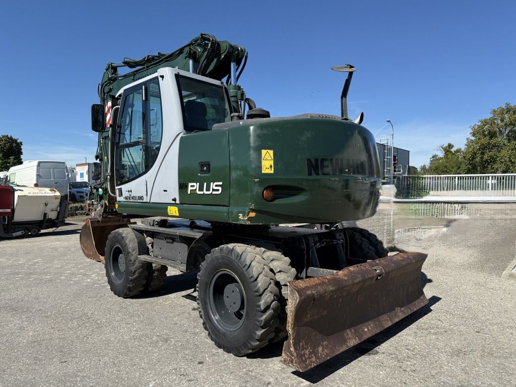 2009 New Holland MH-PLUS wheel excavator, rear three-quarter view 2009 New Holland MH-PLUS wheel excavator, rear three-quarter view