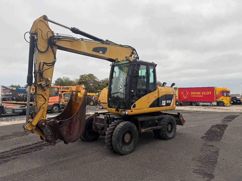 2008 Caterpillar M313D wheel excavator, side view 2008 Caterpillar M313D wheel excavator, side view
