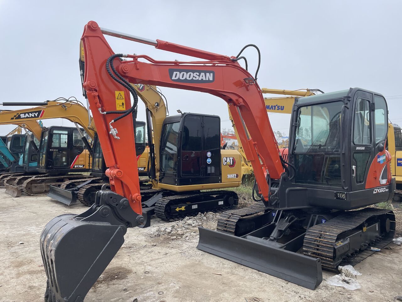2023 Doosan DX60-9C mini excavator, front three-quarter view