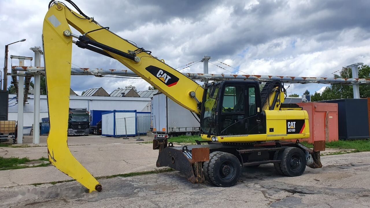 2011 Caterpillar M318D MH material handler, side view 2011 Caterpillar M318D MH material handler, side view