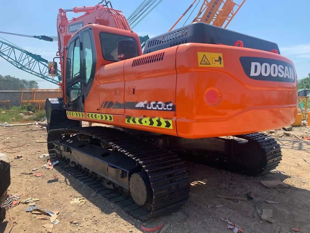 Doosan DX300 crawler excavator, rear three-quarter view Doosan DX300 crawler excavator, rear three-quarter view