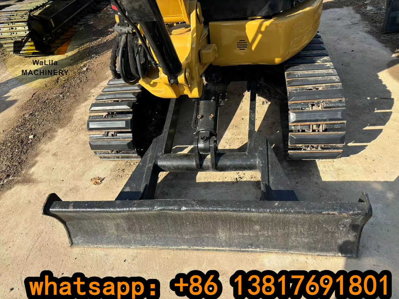2023 Caterpillar 303CCR mini excavator front view with blade