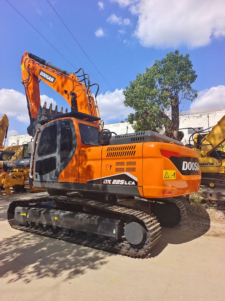 2024 Doosan DX225LCA crawler excavator, rear three-quarter view