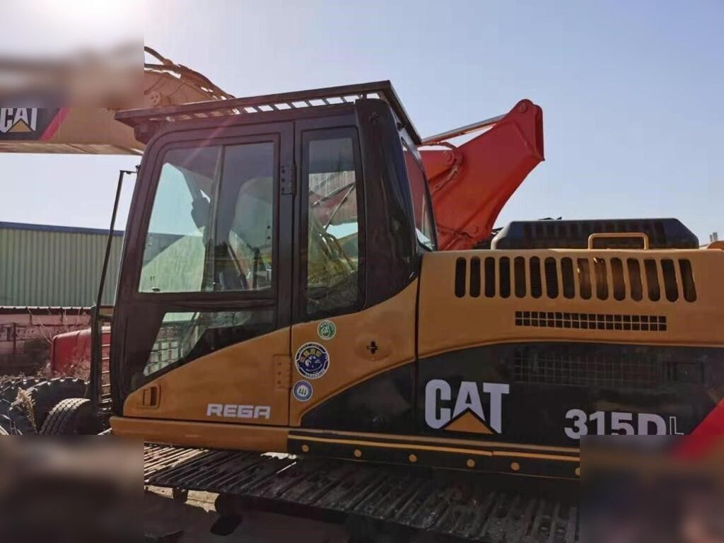 2019 Caterpillar 315DL crawler excavator side view of cab