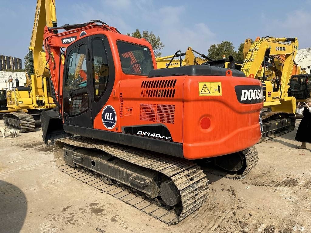 2023 Doosan DX140LC-9C crawler excavator, rear three-quarter view
