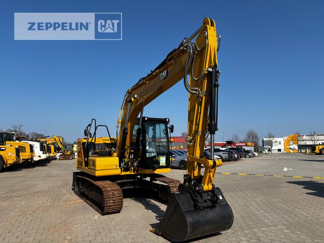 2021 Caterpillar 313-07B crawler excavator, front three-quarter view