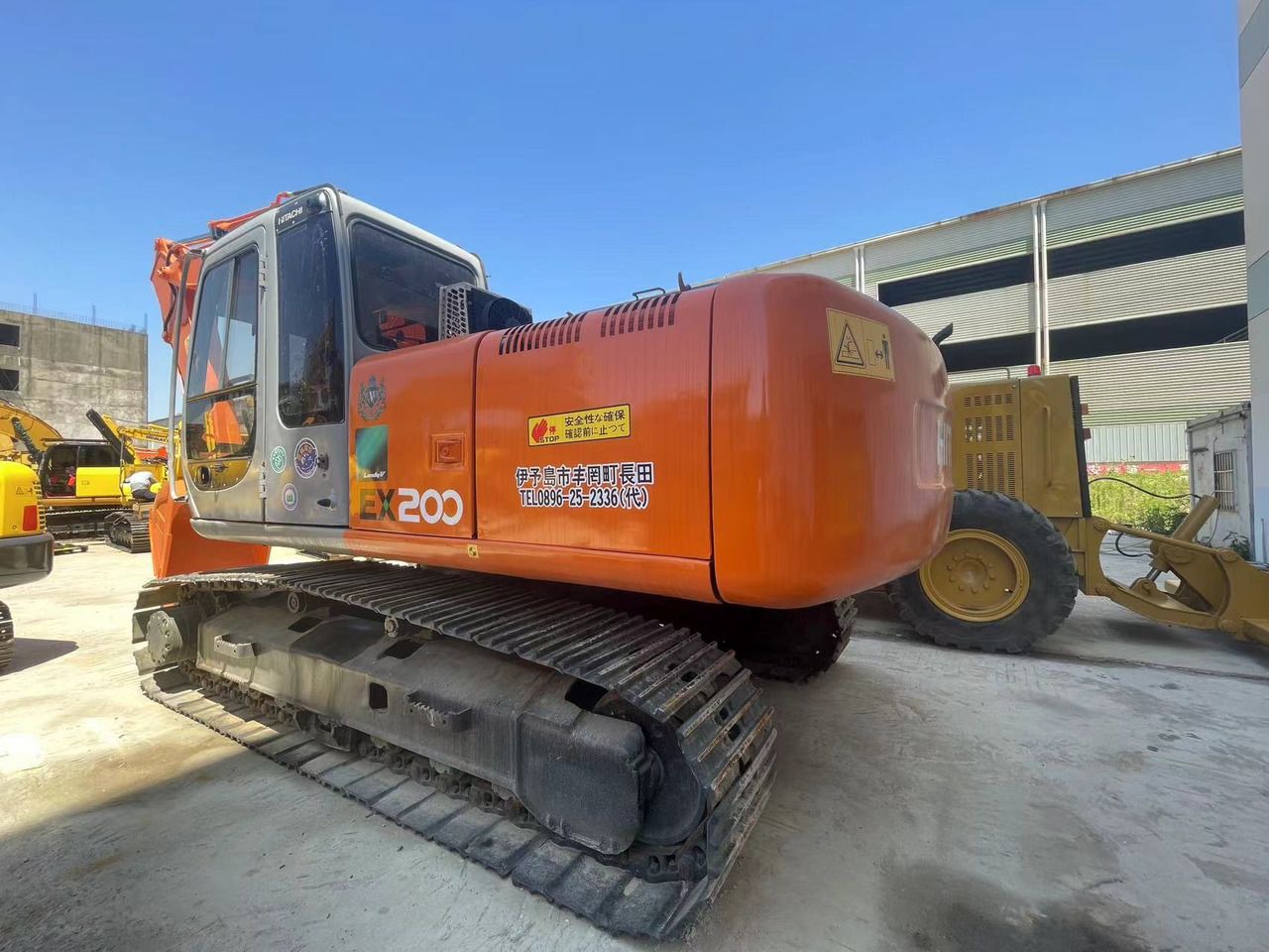 2005 Hitachi EX200 crawler excavator, rear three-quarter view