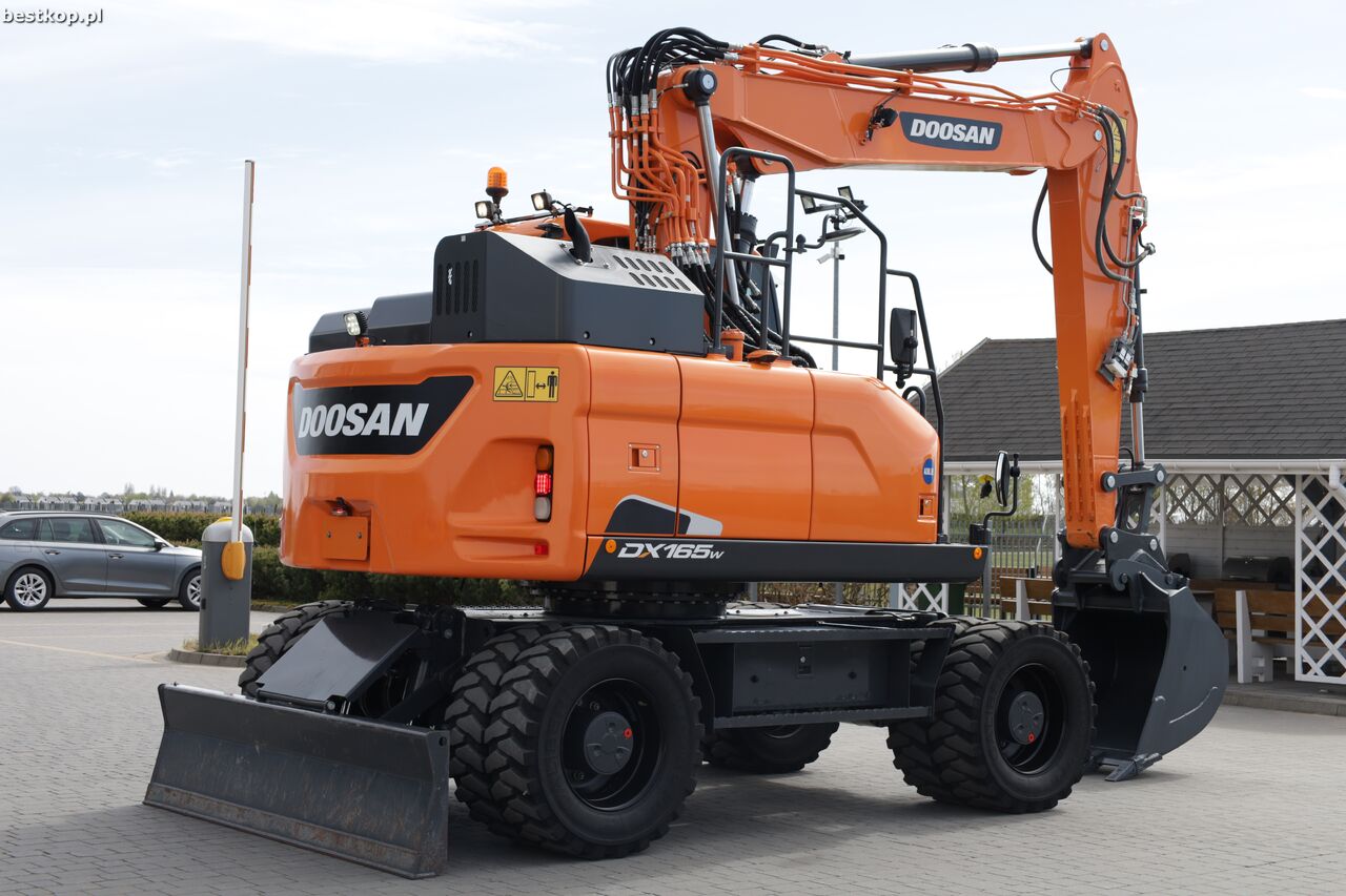 2020 Doosan DX165W-5 wheel excavator, rear three-quarter view 2020 Doosan DX165W-5 wheel excavator, rear three-quarter view