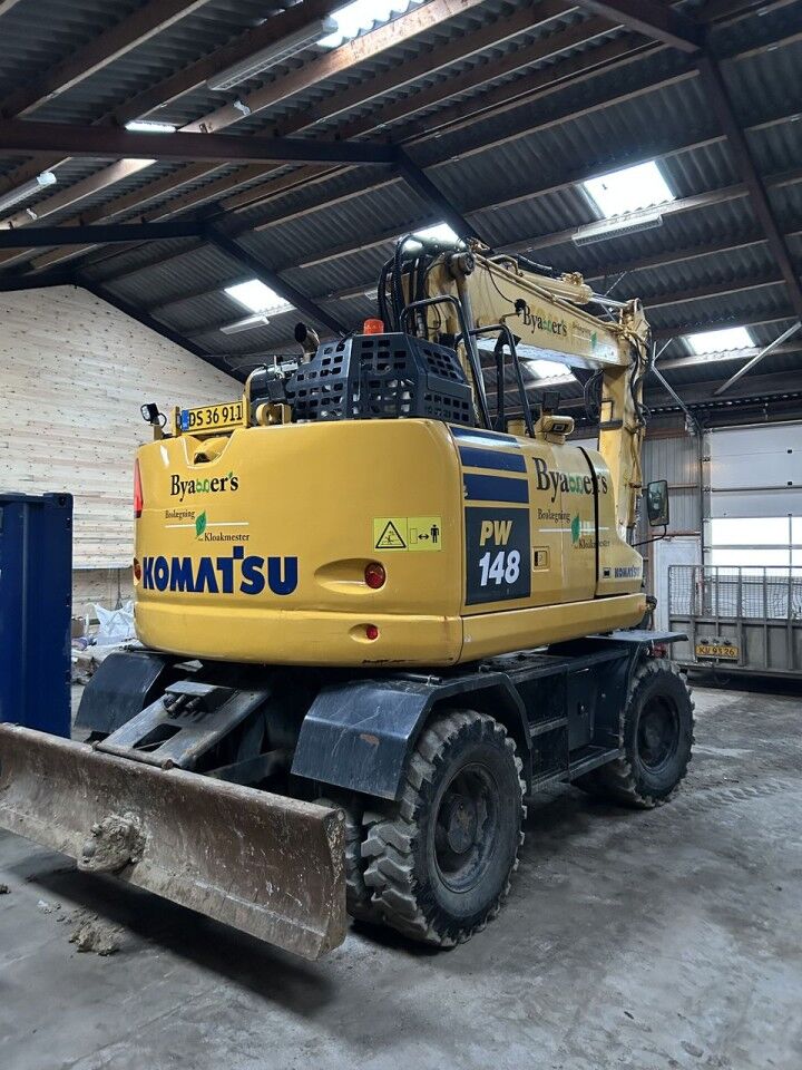 2018 Komatsu PW148-11 wheel excavator, rear three-quarter view 2018 Komatsu PW148-11 wheel excavator, rear three-quarter view