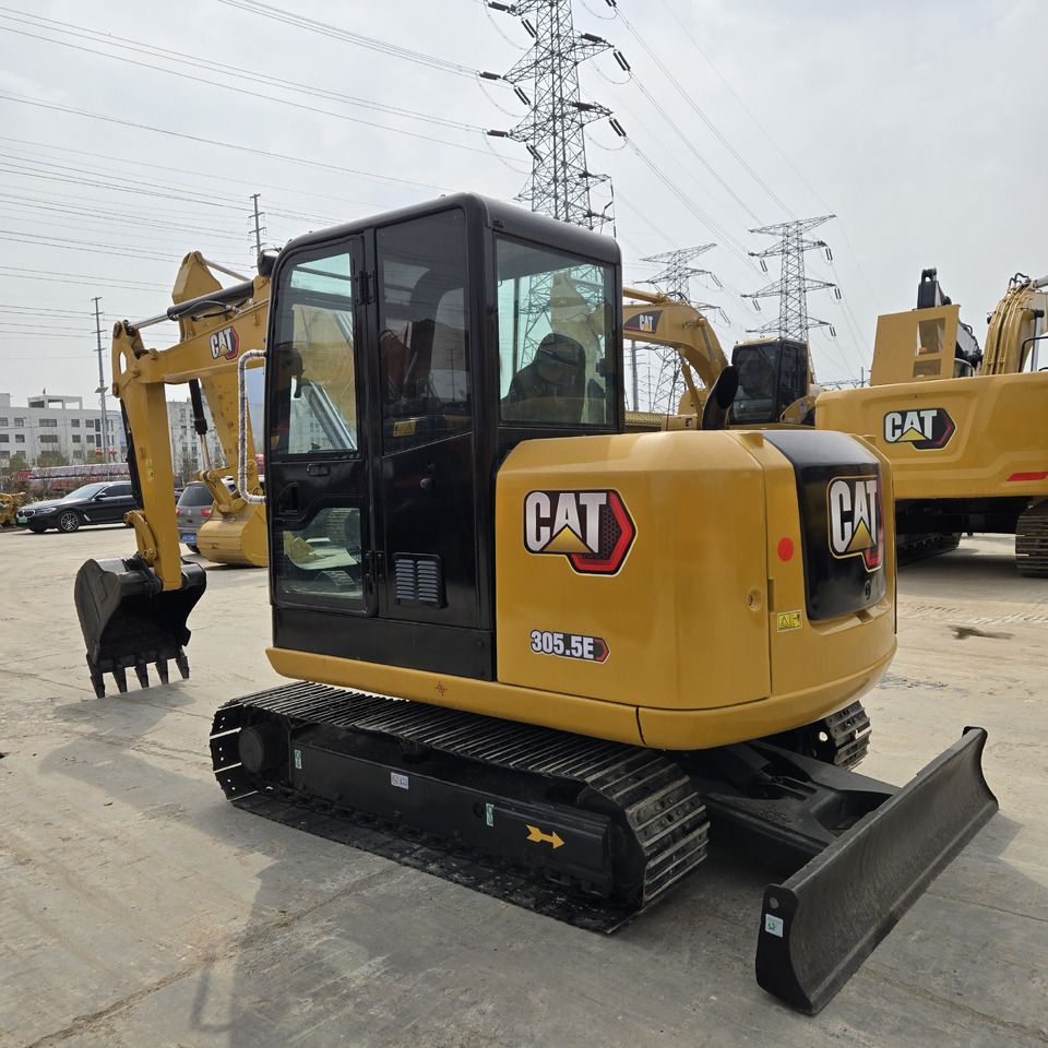 2023 Caterpillar 305.5E mini excavator, rear three-quarter view 2023 Caterpillar 305.5E mini excavator, rear three-quarter view