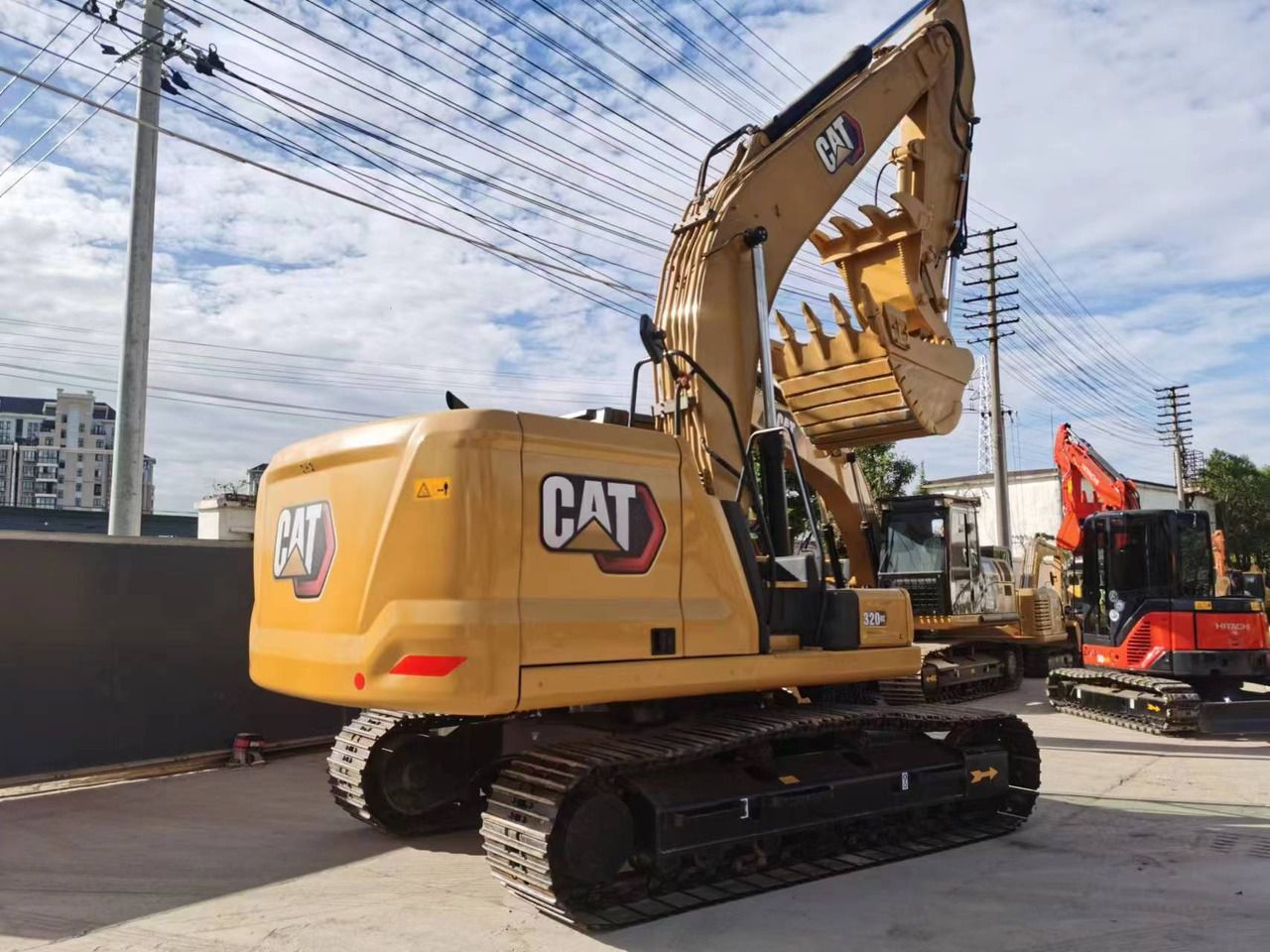 2022 Caterpillar 320GC crawler excavator, rear three-quarter view