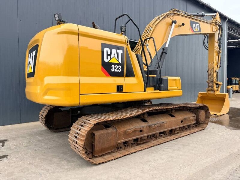 2018 Caterpillar 323 crawler excavator, rear three-quarter view 2018 Caterpillar 323 crawler excavator, rear three-quarter view
